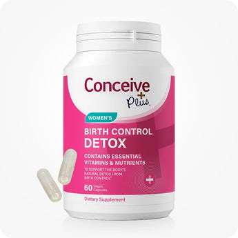 Conceive Plus Birth Control Detox bottle with 60 capsules, shown in bright pink and white packaging labeled for women's use, designed to support body’s natural detox from birth control, with two transparent capsules displayed beside container.
