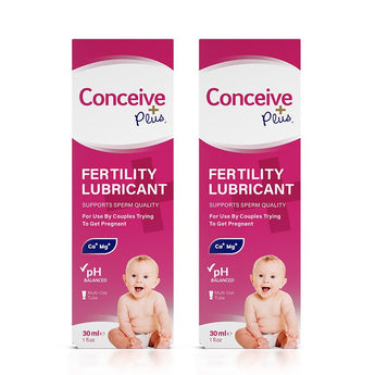 Conceive Plus Fertility Lubricant (1fl.oz/30ml Tube) twin pack featuring two boxed units side by side with bright pink design, baby image, and claims including sperm quality support, pH balance, and multi-use format.